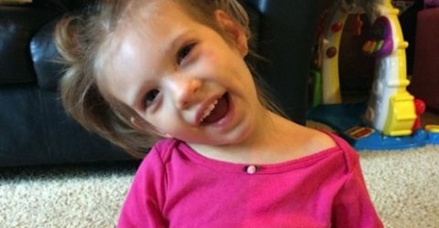 Caroline Wooley smiling in a pink shirt