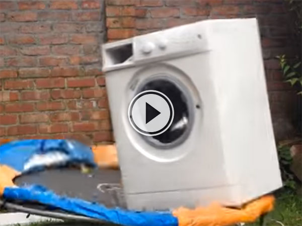 A brick inside a washing machine tied to a trampoline (Video)