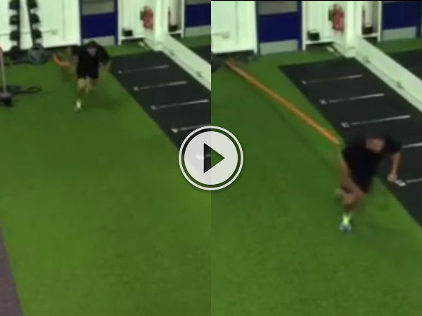 Guy in a gym is running and his bungee cord snaps making him dance in pain.