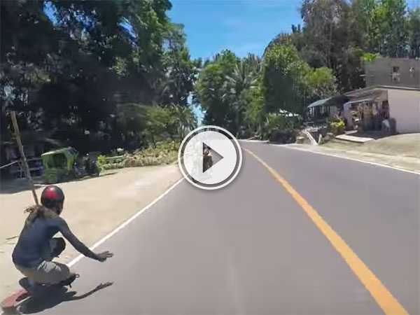 Longboarder just misses motorcyclist (Video)