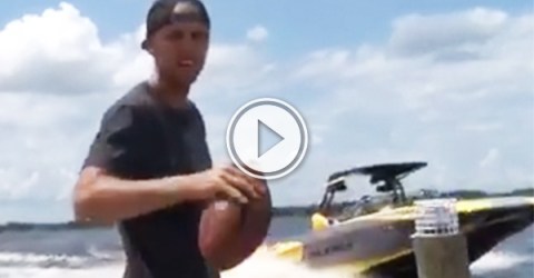 Wakeboarder splendidly catches a football mid backflip (video grab)