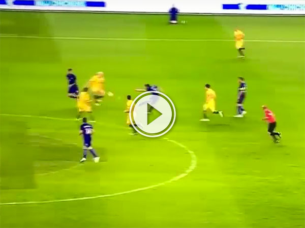 Soccer players in blue and yellow jerseys on a field!