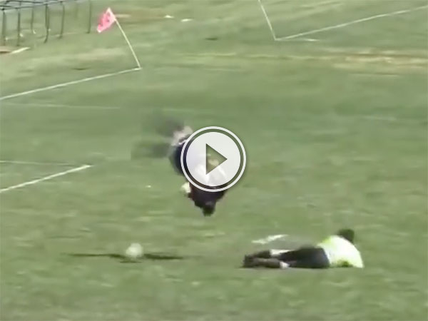 High school soccer player flips over goalie (Video)