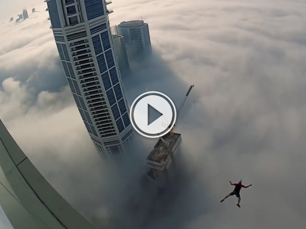 Base jumping through a fog of skyscrapers (Video)