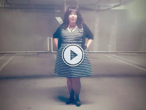 Woman sings opera in an empty parking garage