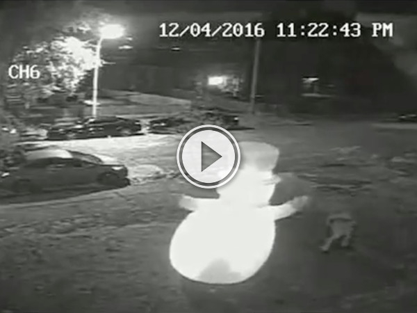 What the hell does this guy have against inflatable lawn snowmen? (Video)