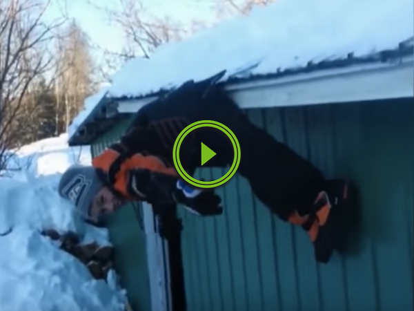 Kid falls off a snowy roof, but doesn't nail the landing (Video)
