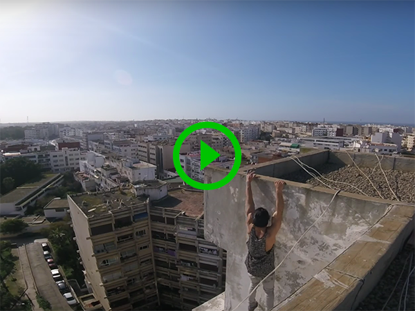 Man does workout on top of high-rise building (Video)
