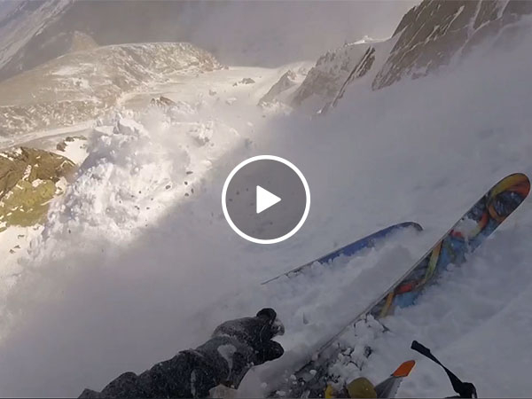 Skier caught in massive avalanche (Video)