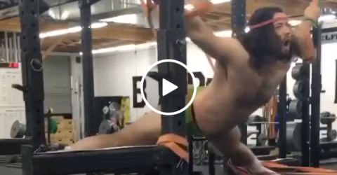 Guy strapped to elastic bands has a crazy new workout (Video)