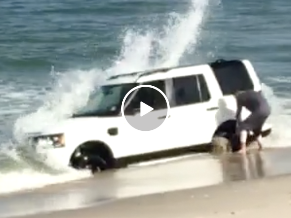 Kid gets Land Rover stuck in beach (Video)
