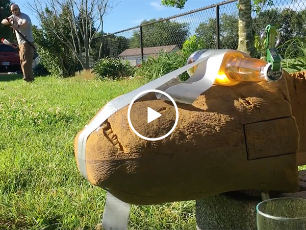 Guy opes beer with bow and arrow