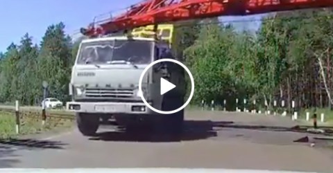 Truck driver crashes when trying to cross train tracks