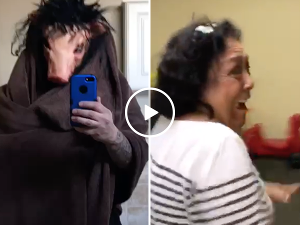 Woman has hilarious reaction to man in pig mask (Video)