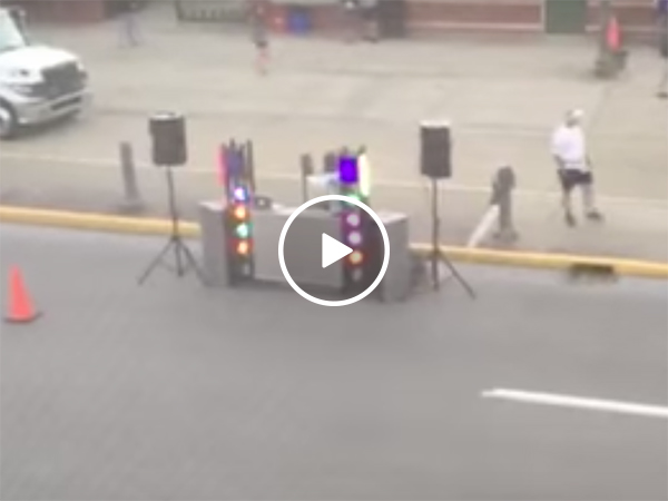 Hungover woman wakes up to an MC and music across the street
