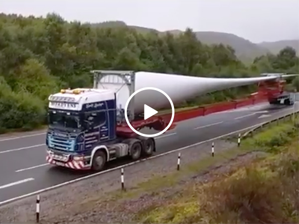 Truck Makes Tight Turn Onto Bridge