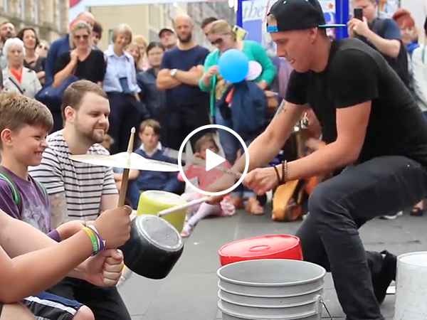 Street performer puts on amazing drum solo using buckets (Video)