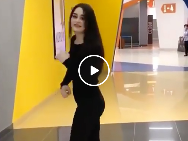 Sexy and Fit Girl Punches an Arcade Game and Almost Knocks It Over