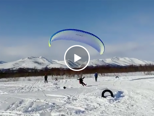 Parasailing Off a Snowmobile Goes Horribly Wrong