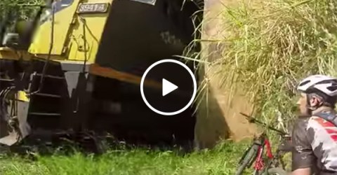 Cyclist narrowly misses train coming the other way through tunnel