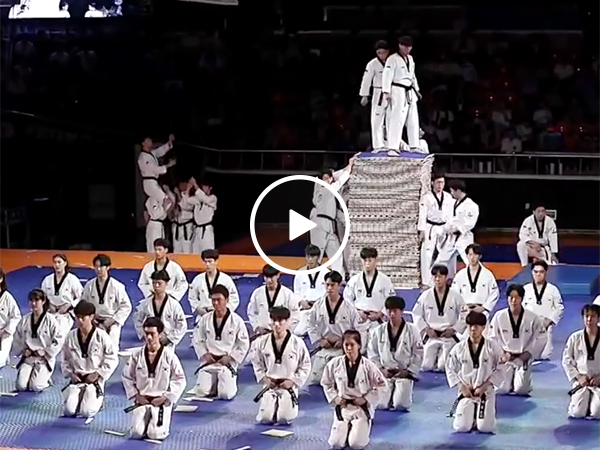 Korean Karate Team Kicks Boards and Does Backflips