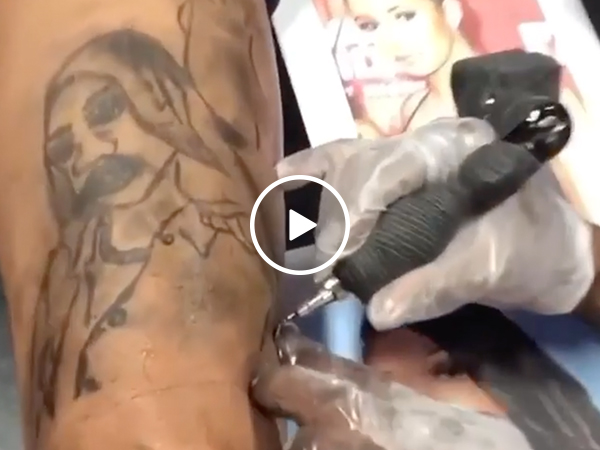 He... he just sat there and let that tattoo happen? (Video)