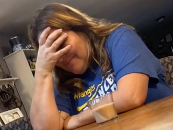 Oblivious mom has drink swapped with a candle (Video)