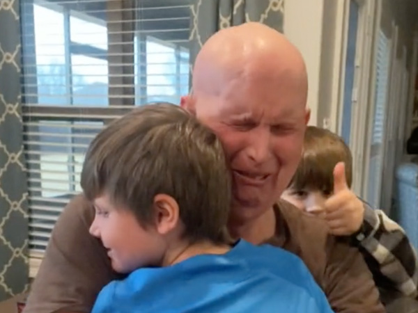 Students help a stroke survivor hug his grandkids (Video)